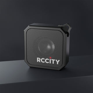 Black portable speaker with 'RCCCity' branding on a dark background