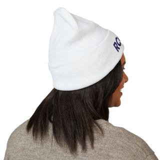 Person wearing a white beanie with 'RC' logo 