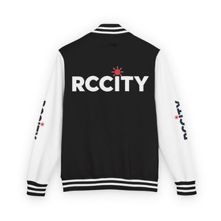 Person wearing a black and white varsity jacket 