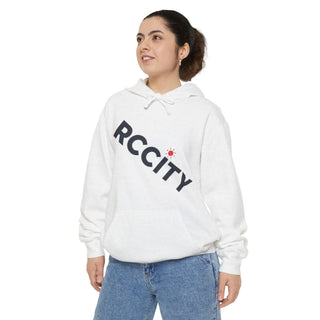 Person wearing a white hoodie with 'RCCITY' printed 