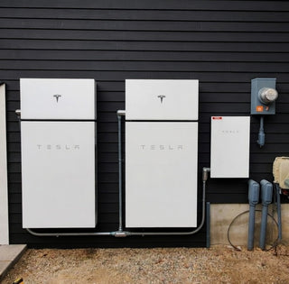 powerwall Plus installed outdoors with connections